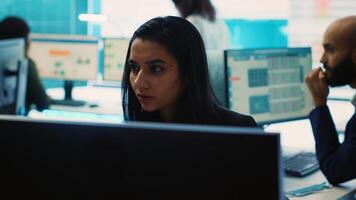Indian office administrator explores partnership opportunities for the global business expansion plans, establishing current enterprise objectives. Analyst doing a win or loss study. Camera A. photo