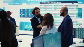 Staff members from a business enterprise discussing details and progress in a new project during a corporate meeting. Company experts getting informed about marketing developments. Camera B. photo