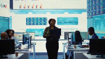 Office administrator exploring collaborations opportunities to expand the business on international market. Establishing organizational goals and reviewing performance metrics. Camera B. photo