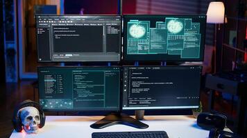 Close up of desk in criminals den and hacking software interface on PC used for stealing data and blackmailing victims. Technology in apartment used for deploying DDOS attacks scripts photo