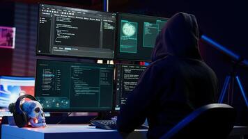 Cybercriminal coding, developing zero day exploit undetectable by antivirus software installed on systems, close up shot. Hooded developer building script able to trick firewalls, camera B photo