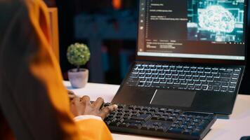 IT student works with artificial intelligence brain system on laptop, translating natural language to code. Girl using machine learning programming software, deep learning algorithms. Camera A. photo