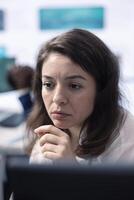 Company employee establishing project details and essential information about achieving business objectives, allocating budget and other resources. Strategic projection on pc. photo