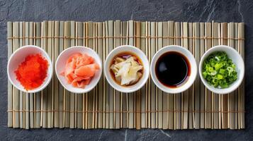 Traditional Sushi Condiments on Bamboo Mat photo