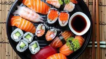 Elegant Top-View Sushi Set on Traditional Black Plate photo