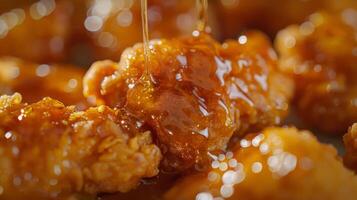 Close-Up of Golden Fried Chicken Drizzled with Honey photo