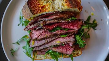 Overhead View of Roast Beef Sandwich with Arugula and Mustard photo