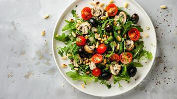 Circular Salad Composition with Arugula, Cherry Tomatoes, and Pine Nuts on White Plate photo