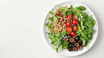 Circular Salad Composition with Arugula, Cherry Tomatoes, and Pine Nuts on White Plate photo