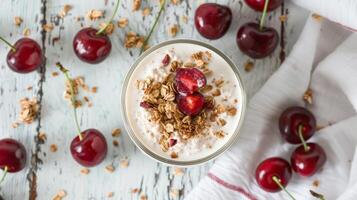 Elegant Kefir Yogurt Glass with Granola and Sweet Cherries photo