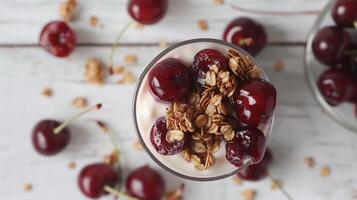 Elegant Kefir Yogurt Glass with Granola and Sweet Cherries photo