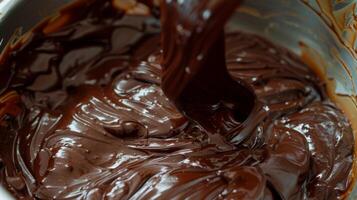 Silky Swirls. Stirring Melted Milk, Dark, and White Chocolate photo