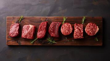 Artistic Arrangement of Steaks on Wooden Board photo