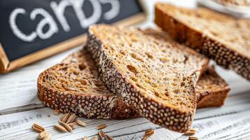 Whole Grain Bread Slices on White Table - Rich in Complex Carbs photo