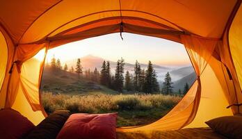 POV of a camping tent on a coniferous forest and mountains in the fog photo