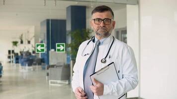 Portrait of a senior doctor in his office in a hospital, s3niorlife and Be H3althy concept video