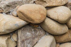 Top view of round river pebbles stones floor photo