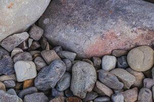 Top view of round river pebbles stones floor photo