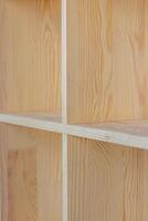 four shelves of the cabinet with a partial focus in the center photo