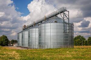 silos granary elevator on agro-industrial complex with seed cleaning and drying line for grain storage photo