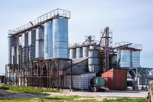 silos granary elevator on agro-industrial complex with seed cleaning and drying line for grain storage photo