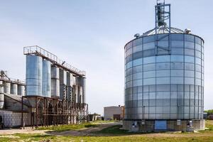 silos granary elevator on agro-industrial complex with seed cleaning and drying line for grain storage photo