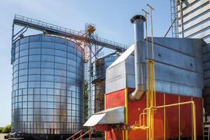 silos granary elevator on agro-industrial complex with seed cleaning and drying line for grain storage photo