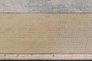 top view of the texture of paving slabs on pedestrian path photo