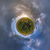 simple tiny planet without buildings in blue sky with beautiful clouds. Transformation of spherical panorama 360 degrees. Spherical abstract aerial view. Curvature of space. photo