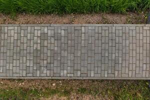top view of the texture of paving slabs on pedestrian path photo
