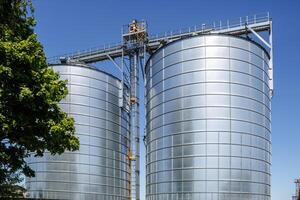 silos granary elevator on agro-industrial complex with seed cleaning and drying line for grain storage photo