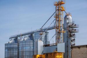 silos granary elevator on agro-industrial complex with seed cleaning and drying line for grain storage photo