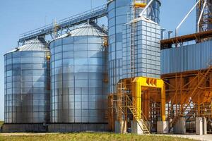 silos granary elevator on agro-industrial complex with seed cleaning and drying line for grain storage photo