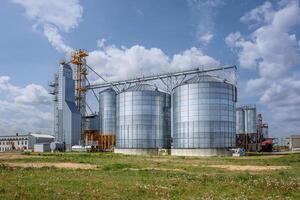 silos granary elevator on agro-industrial complex with seed cleaning and drying line for grain storage photo
