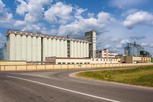 silos granary elevator on agro-industrial complex with seed cleaning and drying line for grain storage photo