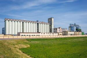 silos granary elevator on agro-industrial complex with seed cleaning and drying line for grain storage photo