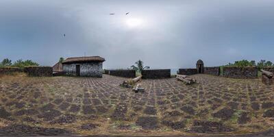 full hdri 360 panorama portuguese defensive abandoned military fortress with old guns on ocean in equirectangular spherical projection with zenith and nadir. VR AR content photo