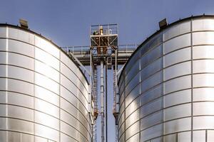 silos granary elevator on agro-industrial complex with seed cleaning and drying line for grain storage photo