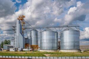 silos granary elevator on agro-industrial complex with seed cleaning and drying line for grain storage photo