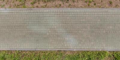 top view of the texture of paving slabs on pedestrian path photo