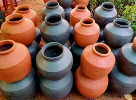 A clay water pot earthen pot for water storage Clay pots not only cool the water down, they also provide healing with the elements of earth. photo