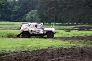 Malpas in Cheshire in the UK in September 2020. A view of a Landrover going through the mud in a field photo