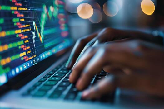 A financial analyst works with real-time stock data on a multi-monitor computer. photo