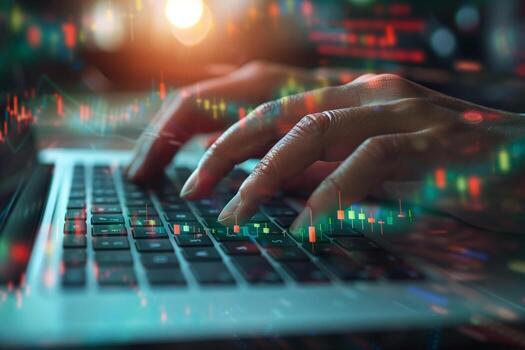 A financial analyst works with real-time stock data on a multi-monitor computer. photo