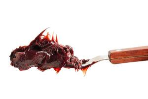 Grease isolated on white background with clipping path, red excellent water resistance synthetic lithium complex. photo