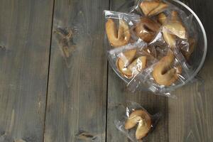 Fortune cookies in a bowl on a gray background with copyspace. 2 3 of the free space. New Year's Eve Traditions photo
