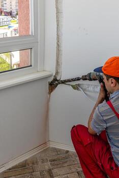 Technician men of the air conditioning system is working Lviv Ukraine 08.04.2024 photo