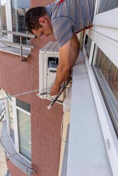 Installing an air conditioner in an apartment office Lviv Ukraine 08.04.2024 photo