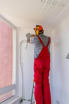 Installing an air conditioner in an apartment office Lviv Ukraine 08.04.2024 photo