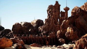 A desert landscape with rocks and a tower video